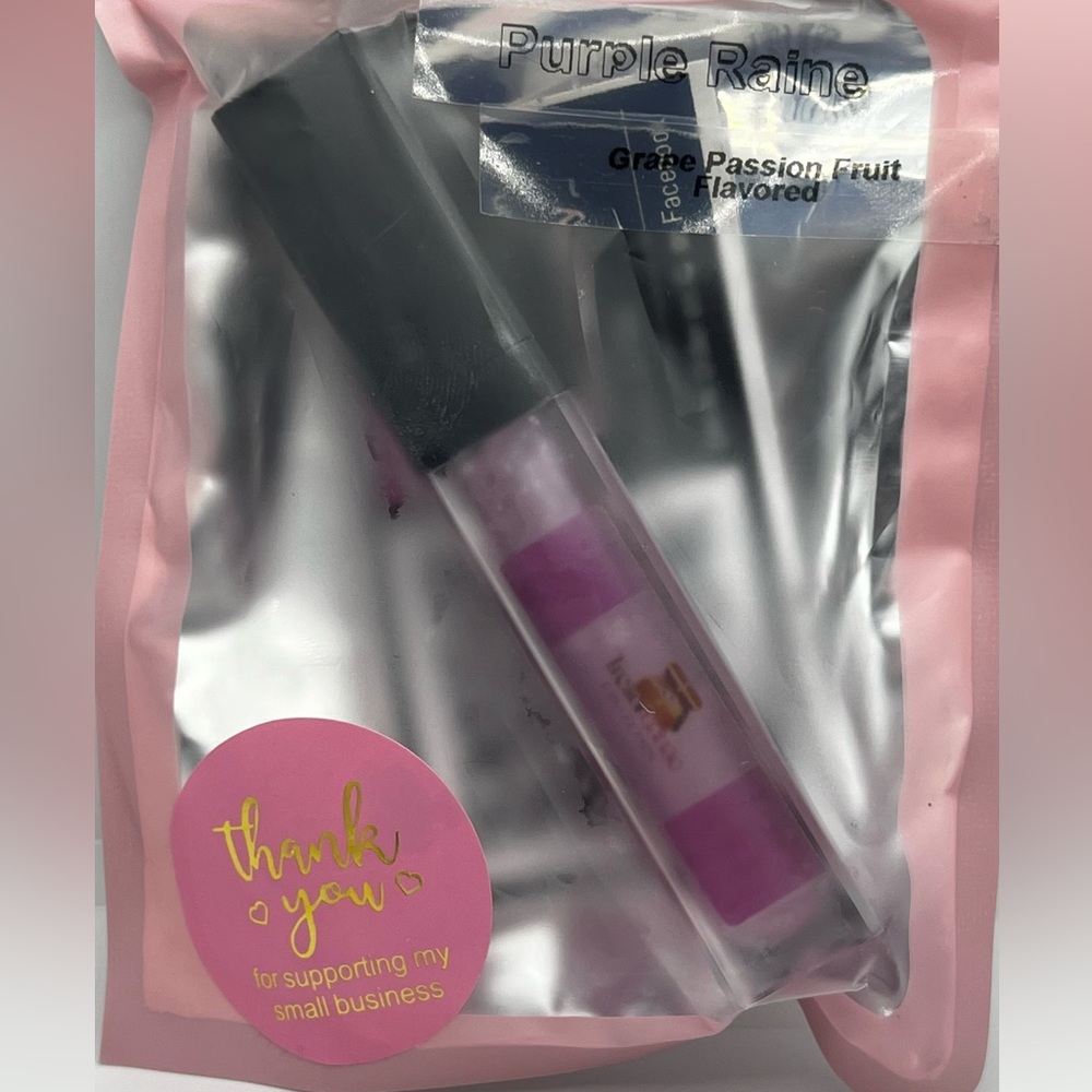 Customized Flavored Lip gloss that has a light and mirror on the tube